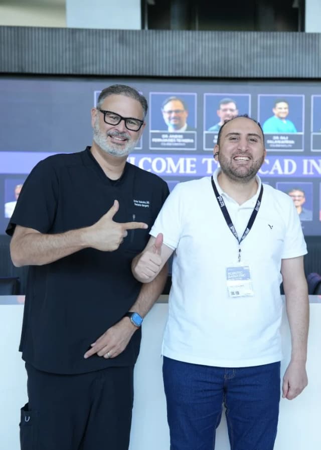 Dr. Mohammad Al-Zaitawi with an international bariatric surgeon at the robotic bariatric surgery program, IRCAD India