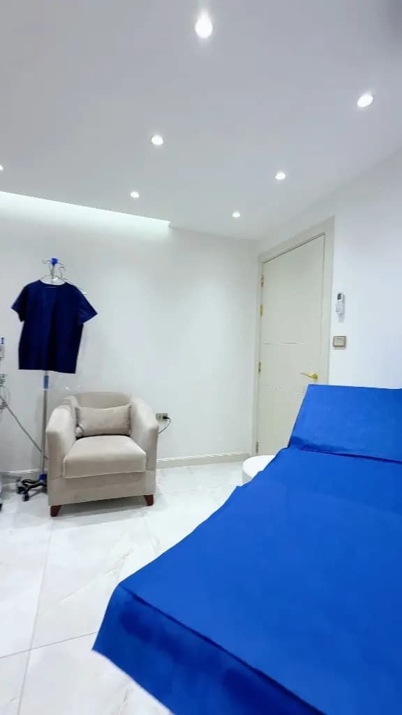 Preparation room at Dr. Mohammad Al-Zaitawi's clinic in Shmeisani The preparation room at Dr. Mohammad Al-Zaitawi's bariatric and laparoscopic surgery clinic in Shmeisani, Amman, with a bed and a chair