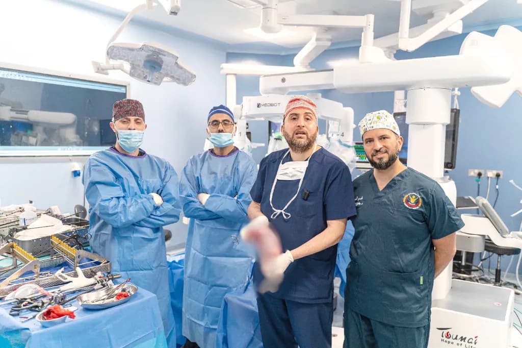 Dr. Mohammad Al-Zaitawi and the surgical team in the robotic operating room after Jordan's first successful robotic sleeve gastrectomy with the Toumai robot, Specialty Hospital, Amman
